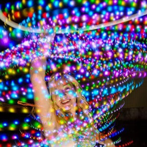 Woman with glowing colorful lights.