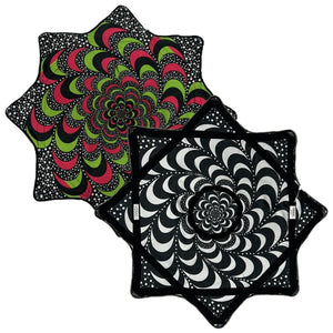 Star-shaped patterned cushions, black & white and red & green variations.