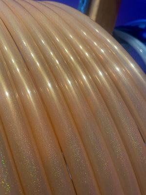 Close-up of iridescent tubes, potentially part of a larger art installation...