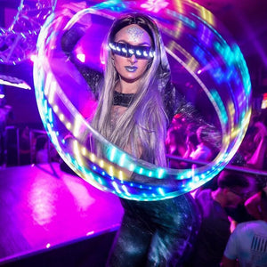 Woman with LED hula hoop at a party
