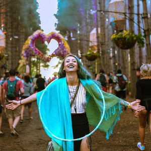 Woman with hula hoop at festival