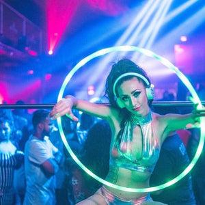 Woman with glowing hoop at a club