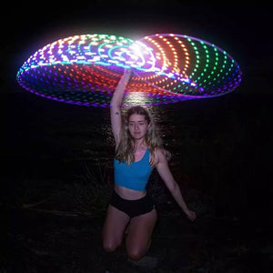 Woman with glowing LED hula hoop