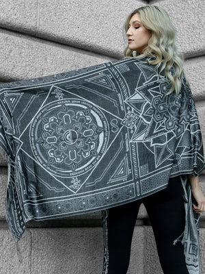 Woman wearing gray and white DHARMA shawl