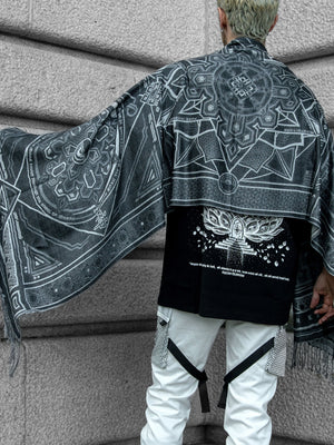 Gray and white DHARMA Shawl on person
