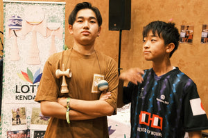 Two young men at a Kendama event