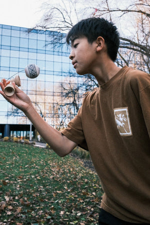 Young man playing kendama, DSCF1436