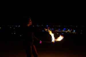 Fire dancer spinning MoonBlaze fire poi.