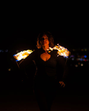 Fire dancer with MoonBlaze fire poi.