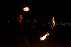 Fire dancer spinning MoonBlaze fire poi