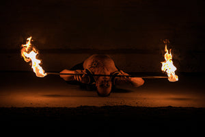 Fire staff performer with MoonBlaze heads