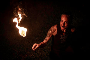 Fire performer with MoonBlaze fire torch.