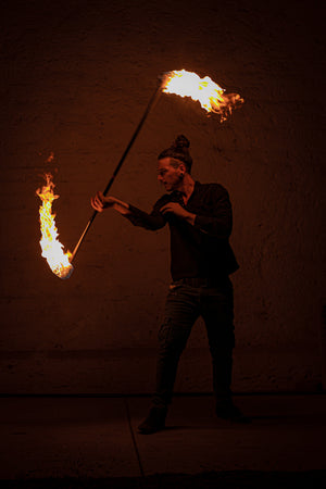Fire performer with fire staff by Fire Mecca