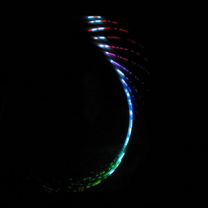 Glowing curved light trails on black background.