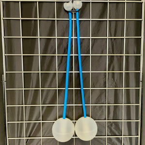 Two ball and stick toy on a grid.