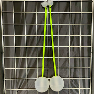 Two white balls connected by green strings.