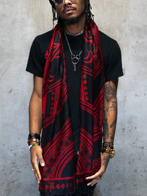 Man wearing red mantra scarf