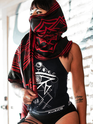Woman wearing red mantra scarf and black top