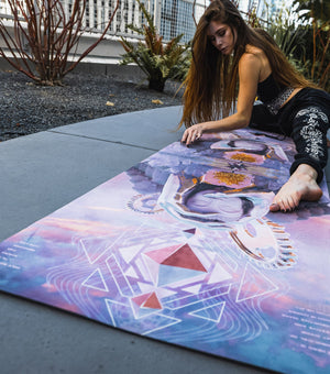 Woman doing yoga on patterned mat