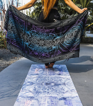 Yoga pose with a patterned shawl and mat