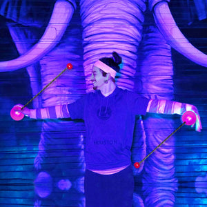 Performer with Orb Poi doing a Pro Action routine.