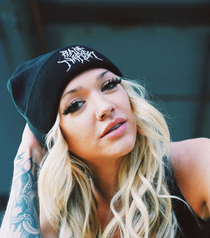 Woman wearing Rage Nation metal beanie