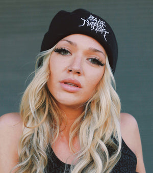 Woman wearing Rage Nation metal beanie