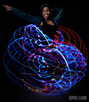 Starlight ray doubles, woman dancing with light trails