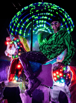 Man on illuminated carousel horse, Feb 14 screenshot.