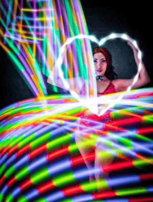 Woman with glowing heart & light trails, Feb 14 screenshot.
