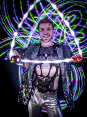 Man holding light-up triangle, screenshot Feb 14, 2023