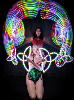 Two women with light trails in a screenshot from Feb 14, 2023.