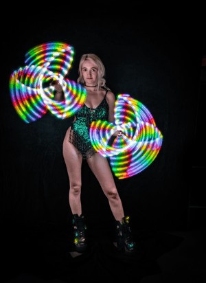 Woman with LED light props, screenshot from Feb 14, 2023.