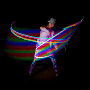 Tyler Wands performer with colorful light trails.