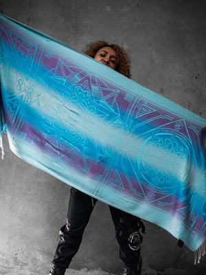 Blue Dharma shawl held by person