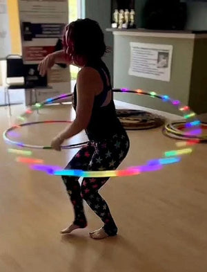 Woman with LED hula hoop