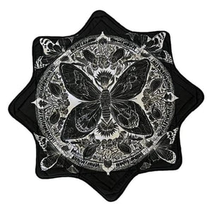 Black and white butterfly mandala design on a star-shaped textile