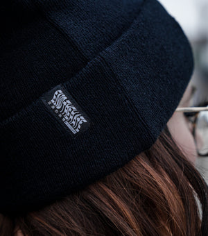 Black beanie hat with label