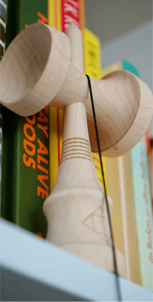 Kendama toy on a bookshelf