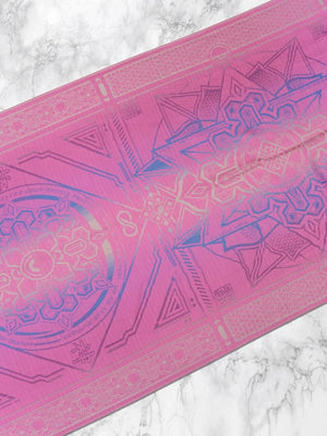 Pink Dharma shawl with intricate design on marble