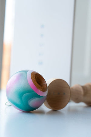 Smaller kendama toy with colorful ball