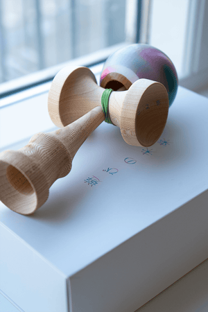 Smaller size wooden kendama toy on box