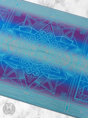 Teal Dharma shawl on marble with geometric design