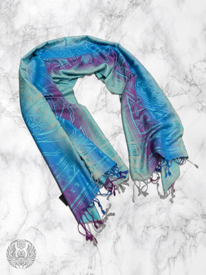 Teal Dharma shawl on marble background