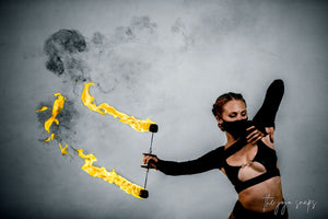 Fire dancer with flaming torches
