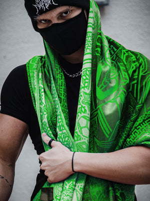 Man in black mask and green shawl