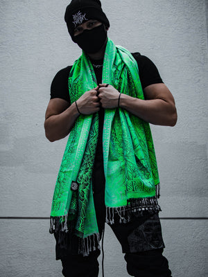 Man in black with green shawl