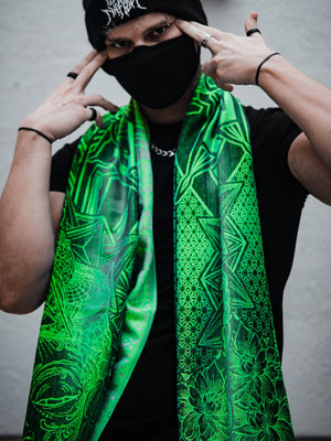 Man in mask with green patterned shawl