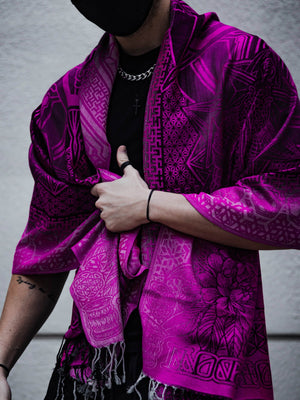 Man in pink patterned shawl