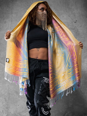 Woman wearing yellow dharma shawl with colorful design